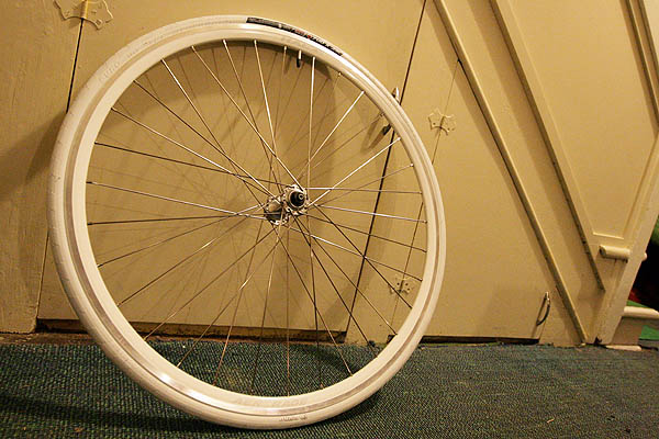 Complete front wheel with Origin8 Elimin8er white 700 x 23c tire